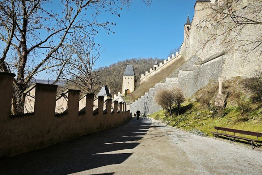A castle with a steep, stone staircase leading up to a tower. 2