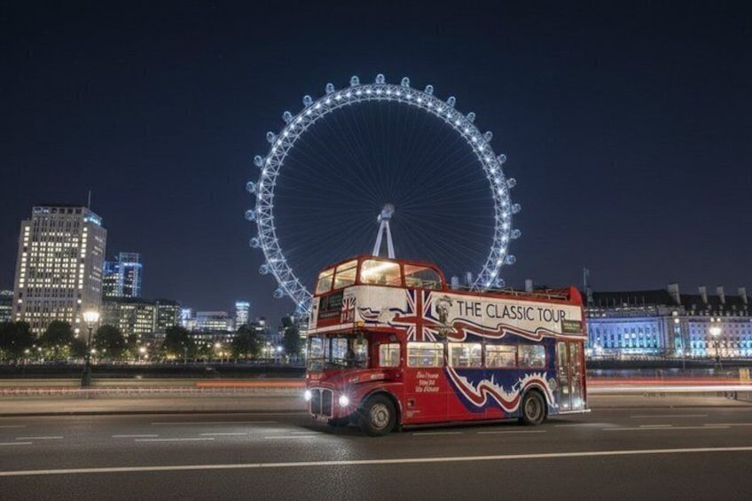 A double-decker bus with 'The Classic Tour' written on the side, driving on a road with a large Ferris wheel in the background. 5