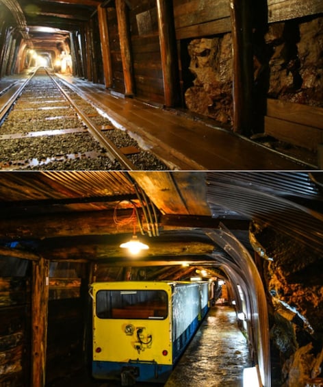 A train in a tunnel with wooden walls and metal tracks. 2