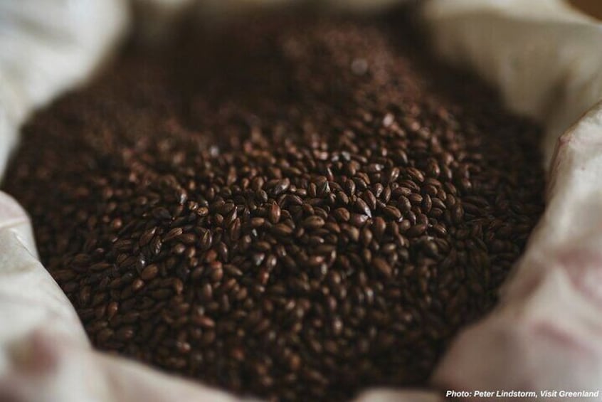 A close-up of coffee beans in a burlap sack. 5