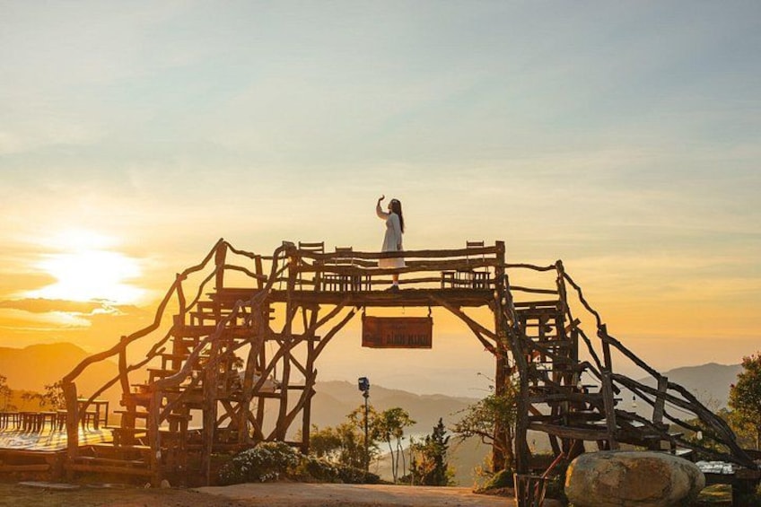 A wooden structure with a platform and a sign that reads 'Plaza.' 4