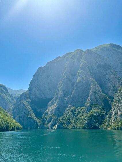 A mountain range with a lake in the foreground. 4