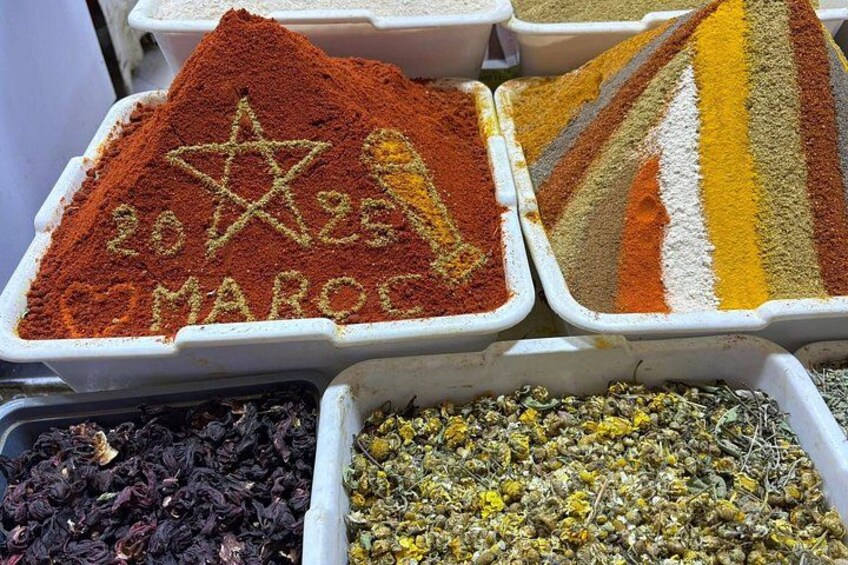 Various spices in containers with a star and text. 1