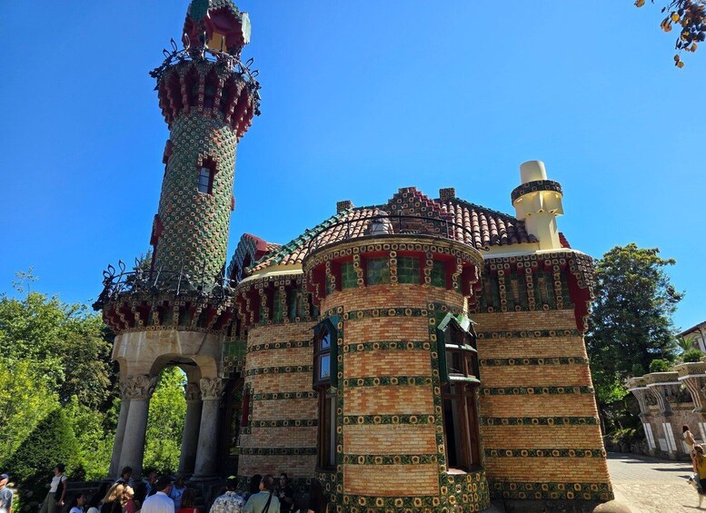 A historic building with a tower and a dome, featuring intricate brickwork and decorative patterns. 3