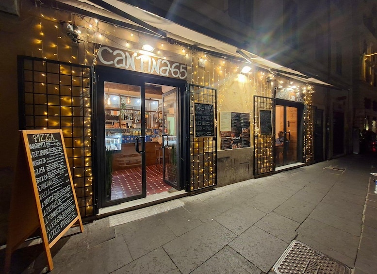 A restaurant named 'Cantina 65' with outdoor seating and string lights. 1