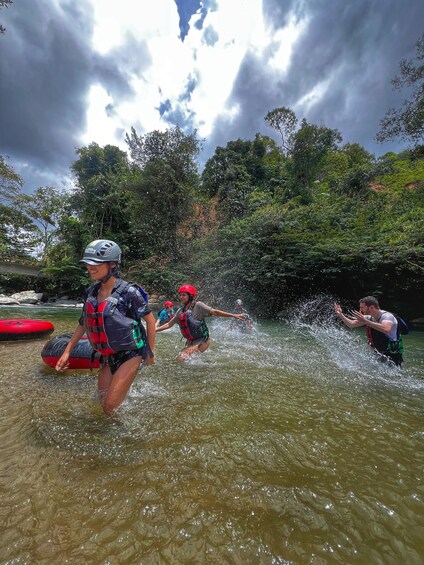 People in water with life jackets and helmets, likely engaging in water activities. 3