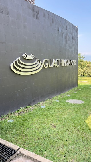 A concrete wall with the text 'GUACHIMONTONES' and a stylized logo. 2
