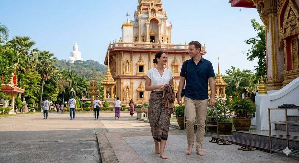 A couple walking in front of a large, ornate temple with a white statue in the background. 3