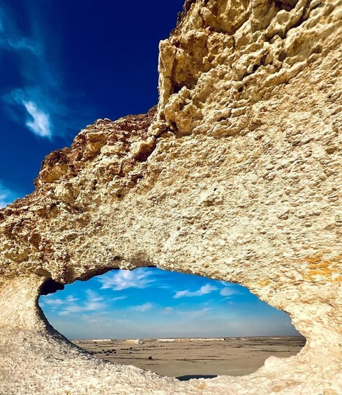 A natural rock formation with a cave-like opening. 5
