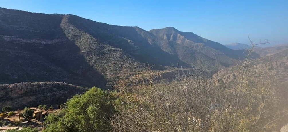 A mountainous landscape with a clear sky. 4