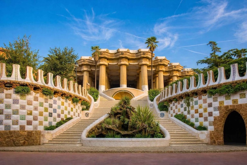 A grand entrance with a checkered wall, a central staircase, and palm trees. 2