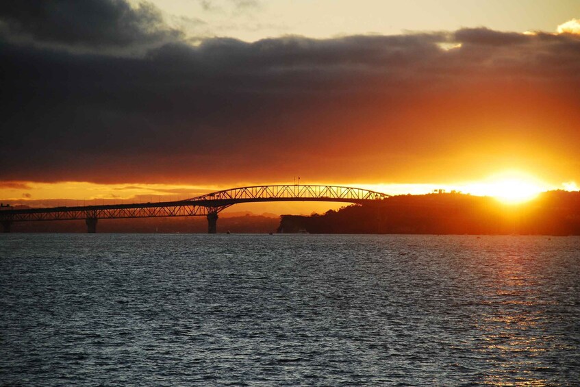 A bridge over water during sunset. 2