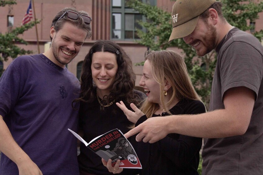 Three people, one holding a book titled 'Murder in the Chicago Loop.' 3