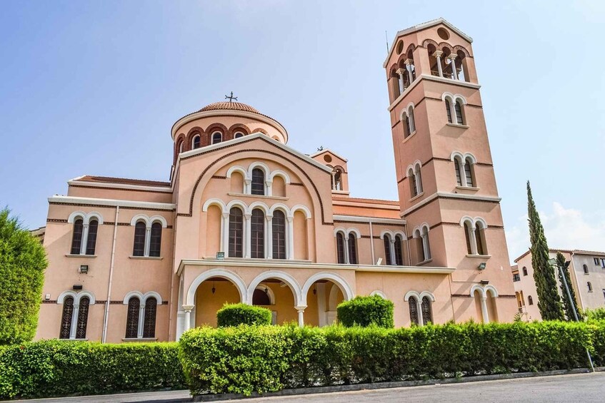 A church with a prominent bell tower and a dome. 5