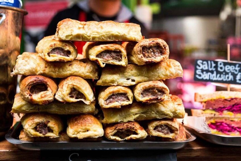 A stack of meat pies on a tray. 2