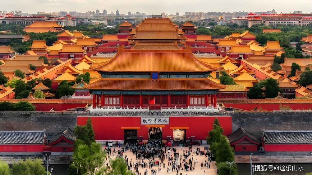 A traditional Chinese architectural complex with multiple buildings featuring ornate roofs and a large gathering of people in front. 5
