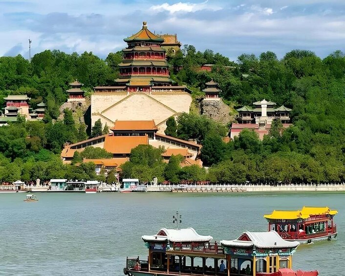 A traditional Chinese pagoda on a hill overlooking a river with boats. 3