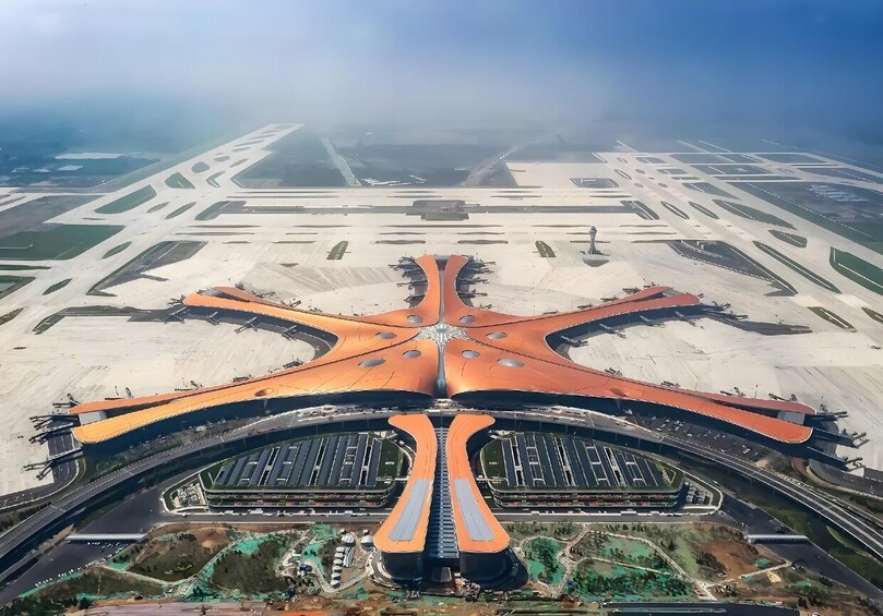 An airport with a distinctive central terminal and multiple runways. 1