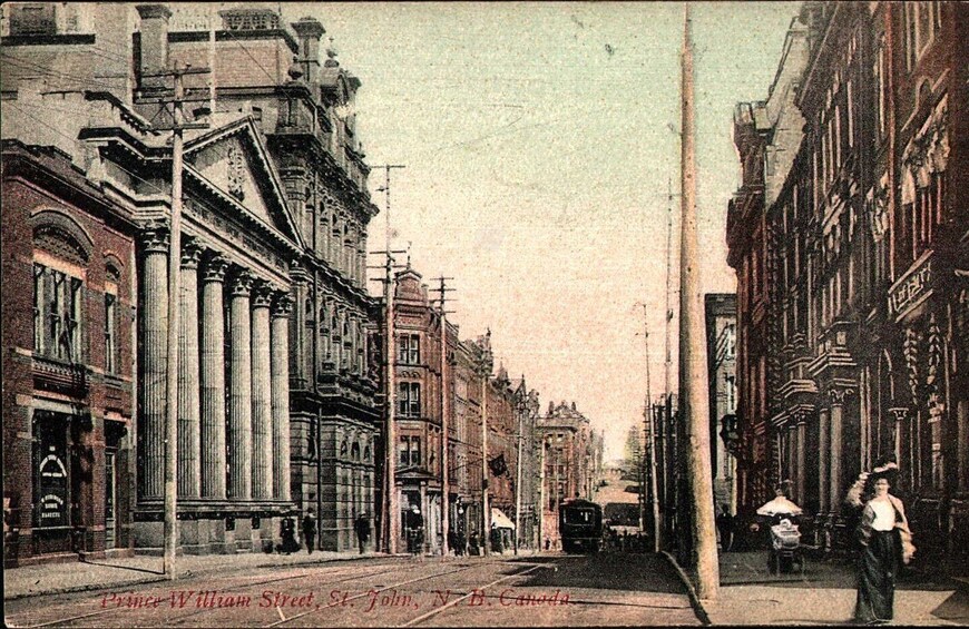 Prince William Street in St. John, N.B., Canada, with historic buildings and a tram. 5
