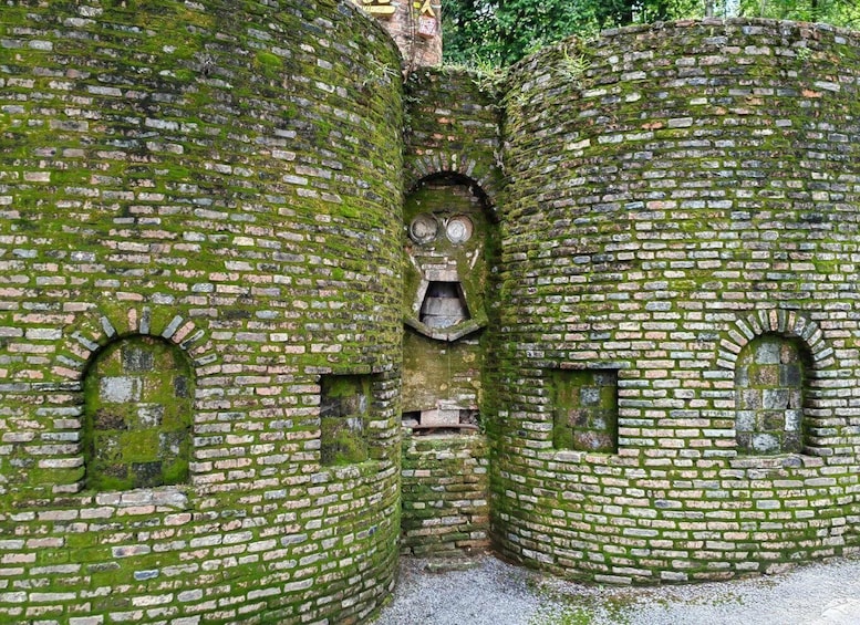 Moss-covered brick walls with arched windows. 4
