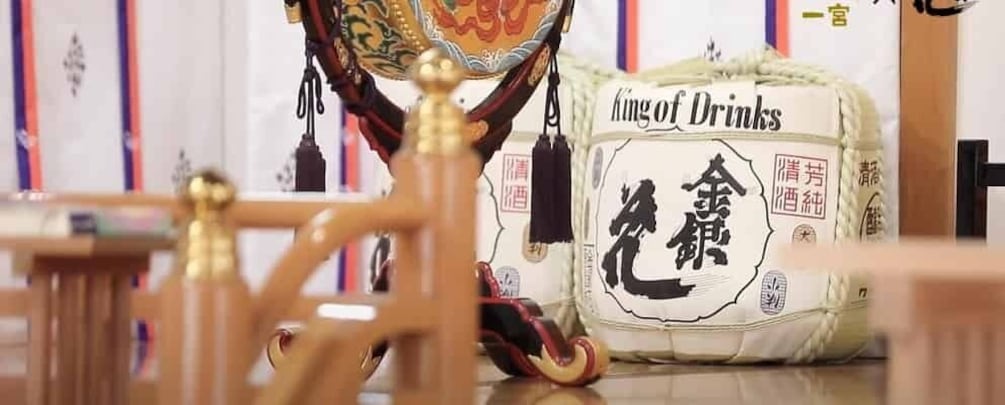 A traditional Chinese tea set with a teapot and cups, and a pillow with Chinese characters. 1