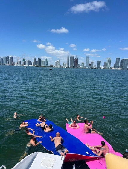 People on a boat with a city skyline in the background. 5