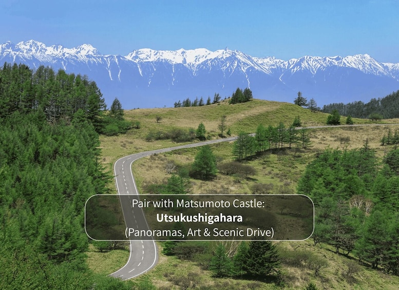 A scenic drive with a mountainous backdrop. 2