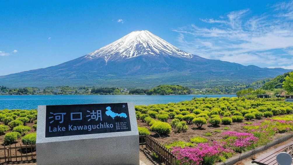 A sign for Lake Kawaguchiko with a view of Mount Fuji in the background. 4