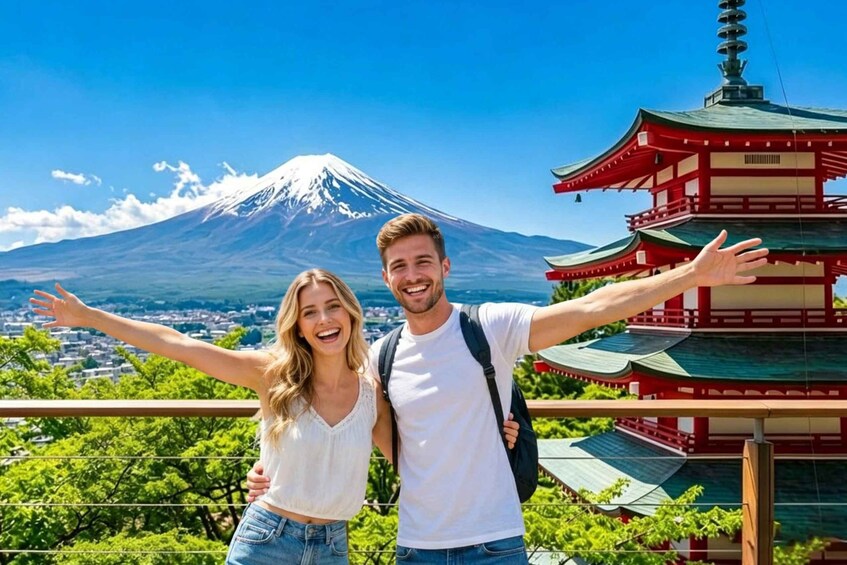 A couple with arms outstretched in front of a traditional Japanese pagoda and Mount Fuji in the background. 1