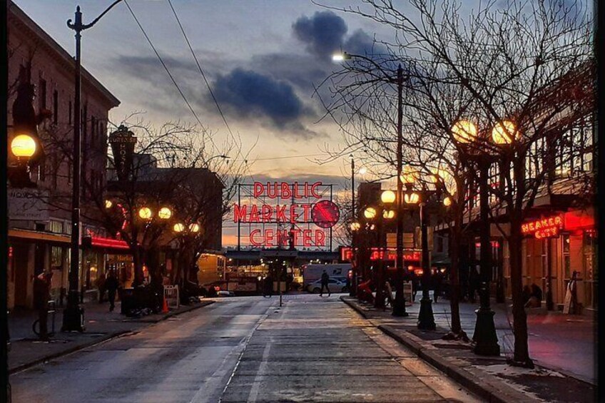 A street with a 'Dublin Market Center' sign, street lamps, and buildings. 2