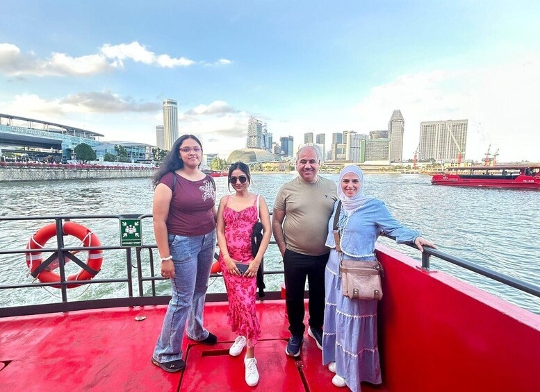 A group of people on a boat with a city skyline in the background. 5