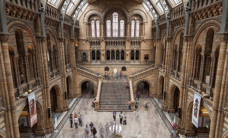 A grand cathedral with arched windows and a central staircase. 2