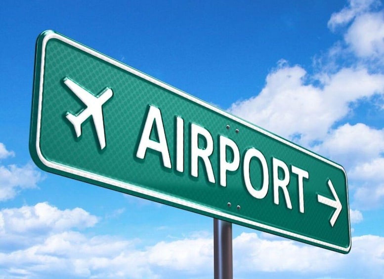 A directional airport sign with an airplane symbol and an arrow pointing right. 4