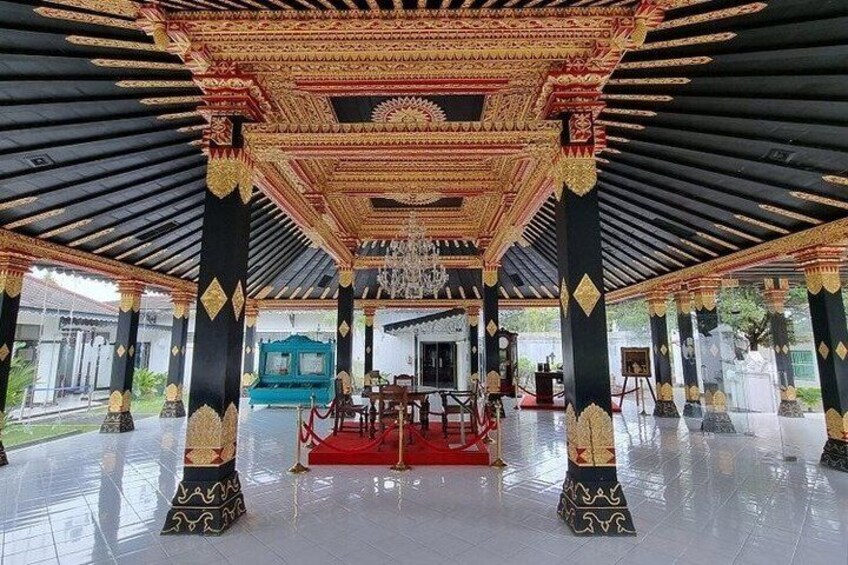 An ornate pavilion with intricate roof designs and patterned columns. 1