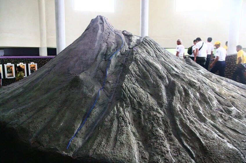 A large volcanic model with a blue line indicating a crack. 3