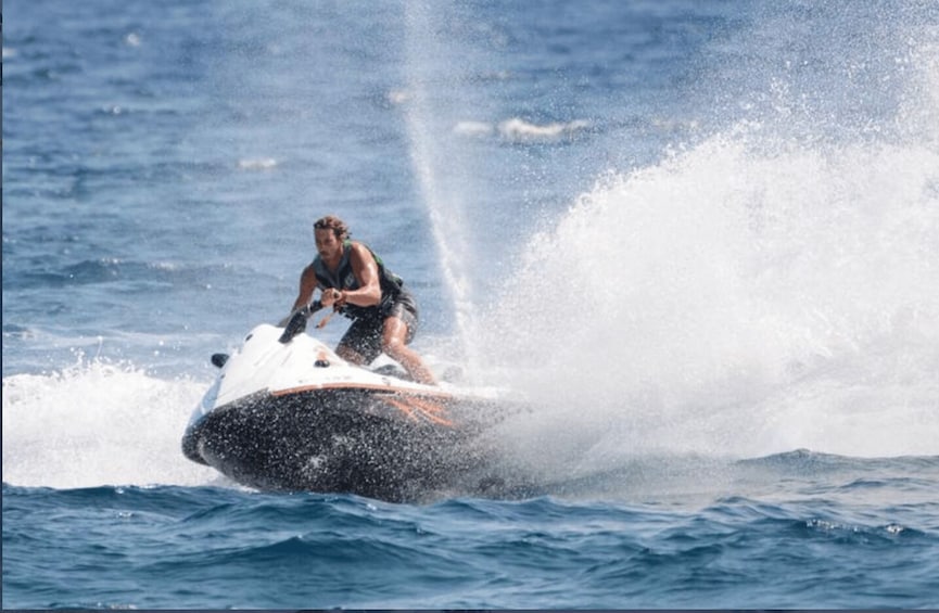 A person jet-skiing on a body of water. 4