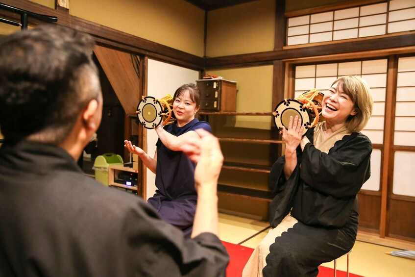 A traditional Japanese interior with tatami flooring, sliding doors, and a low wooden ceiling. 2