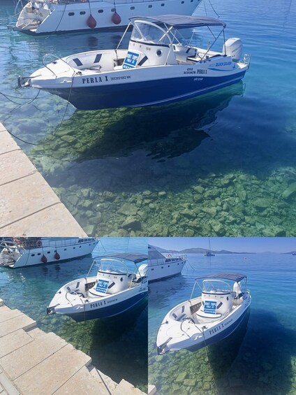 A boat named PERLA X docked at a pier with clear water beneath. 2