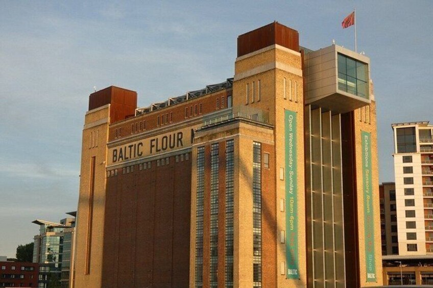 A building with the sign 'Baltic Flour' and a flag on top. 4