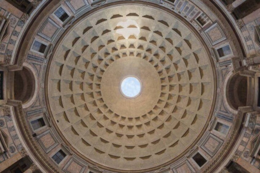 A circular architectural structure with a central skylight and radial symmetry. 3