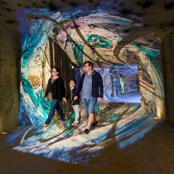 A tunnel with a projection of a colorful abstract painting. 2