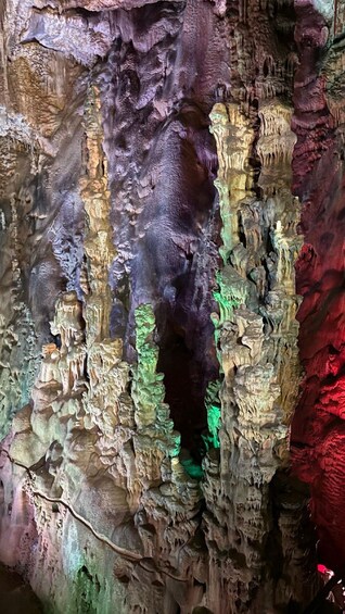 A cave with colorful stalactites and stalagmites. 5