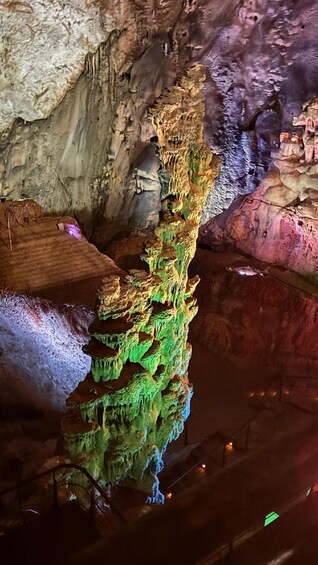 A cave with colorful stalactites and stalagmites. 1