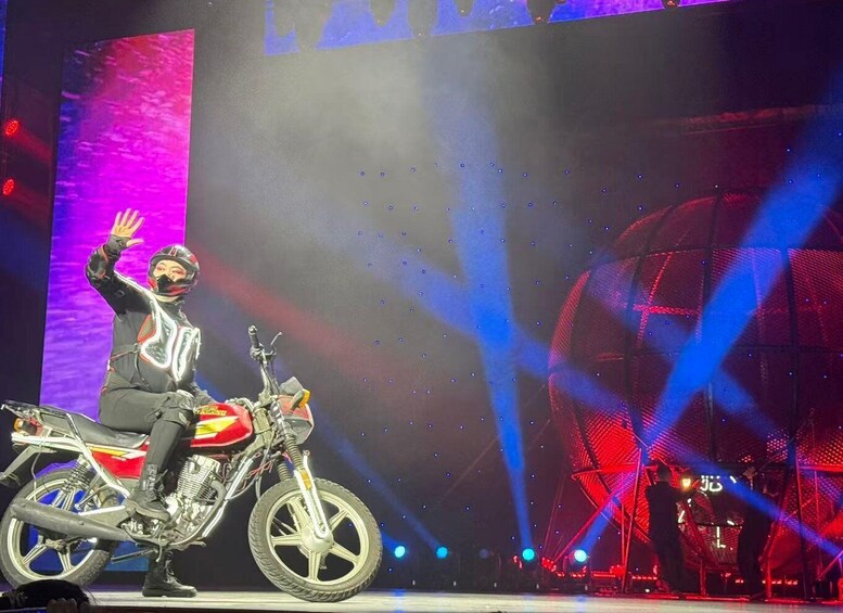 A person on a motorcycle with a digital backdrop. 4