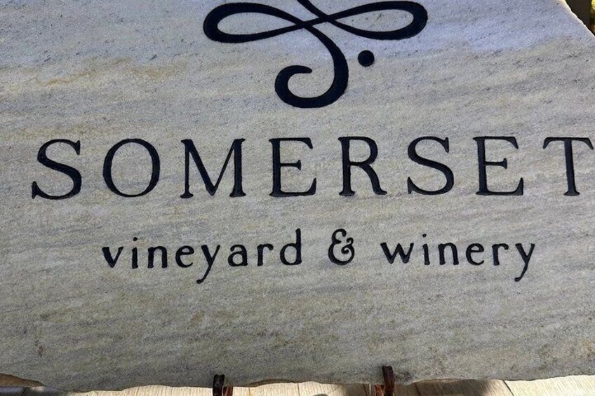 A sign for 'Somerset Vineyard & Winery' with a stylized logo above the text. 2