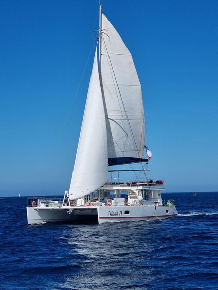 A sailboat named 'Ninah II' on the water. 2