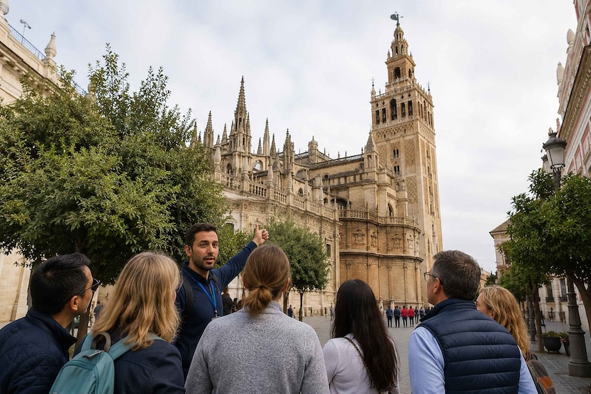 A group of people looking at a historic cathedral with intricate architecture. 4