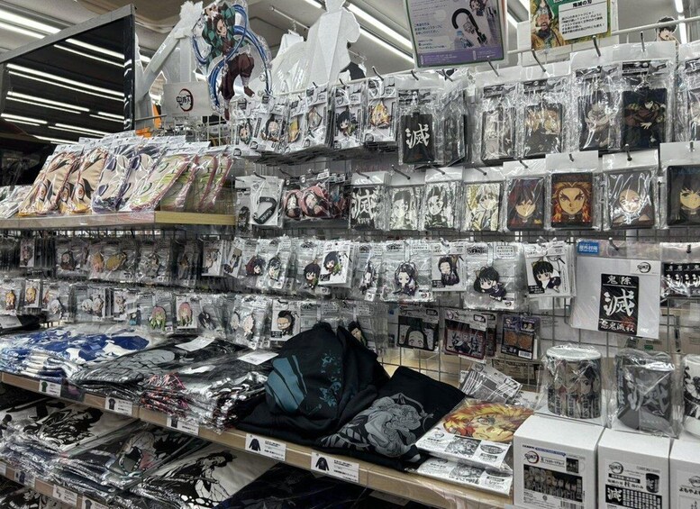 A store shelf stocked with anime merchandise, including figures, keychains, and apparel. 3