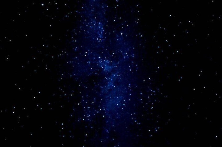 A starry night sky with a dense cluster of stars. 4
