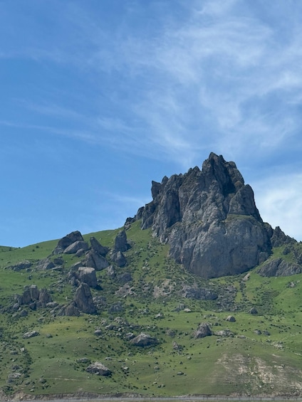 A rugged mountain peak with a clear sky. 3